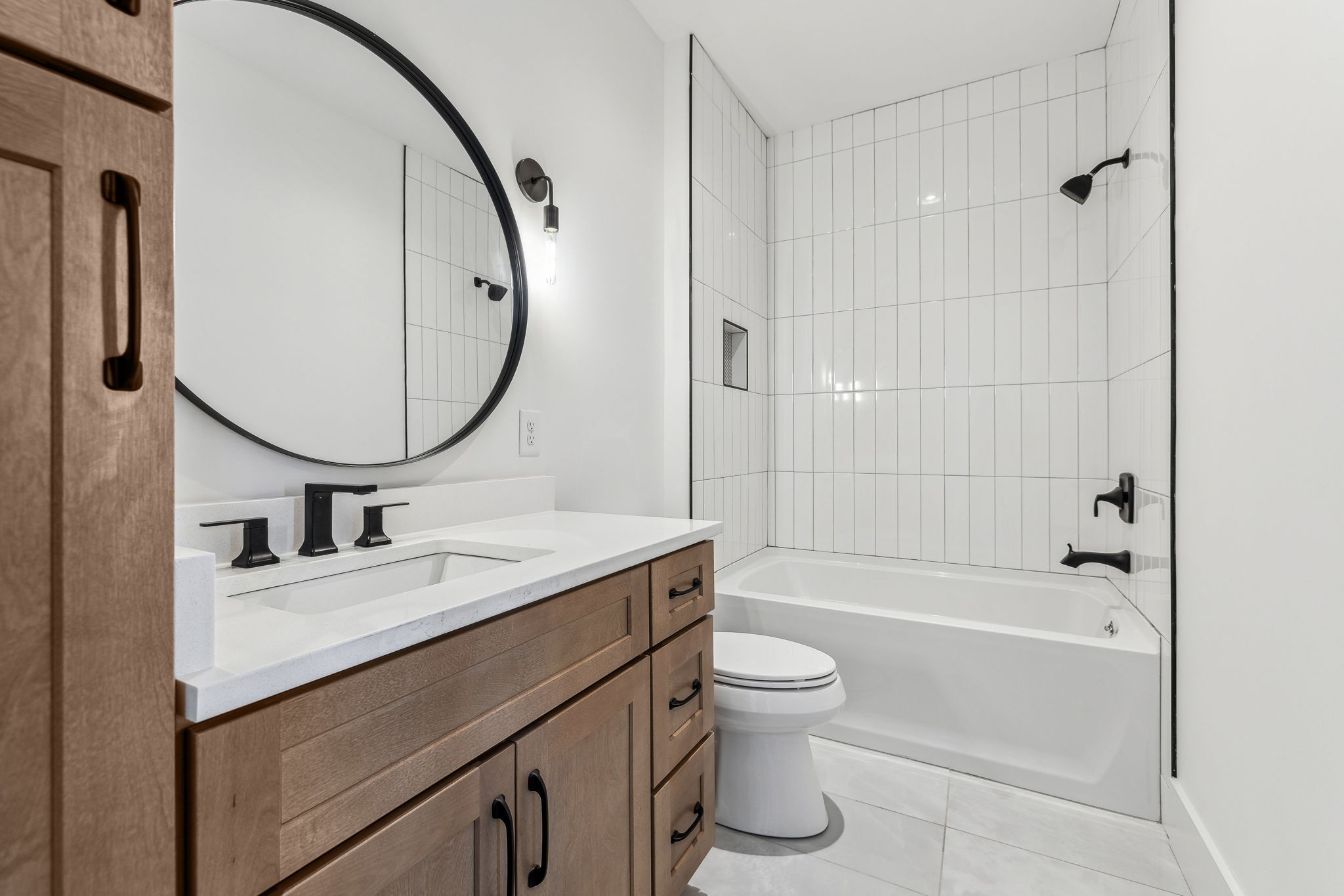 3135 Parthenon Avenue, Unit A Nashville, TN 37203 - Photo 35 of 77 a bathroom with a granite countertop sink a toilet and a mirror