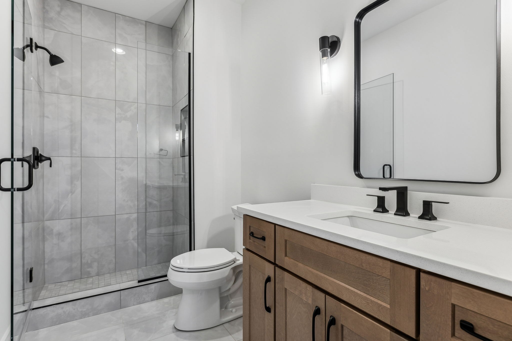 3135 Parthenon Avenue, Unit A Nashville, TN 37203 - Photo 40 of 77 a bathroom with a granite countertop sink toilet a mirror and shower