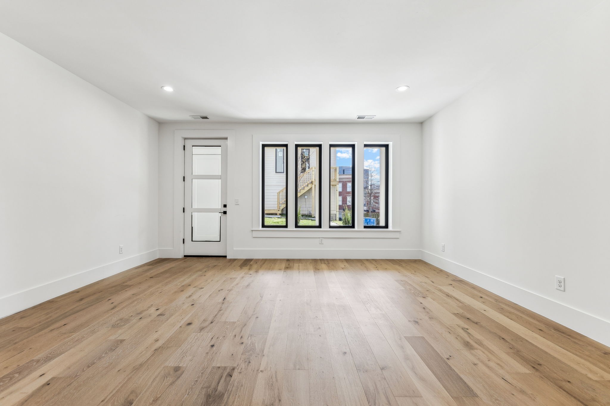 3135 Parthenon Avenue, Unit A Nashville, TN 37203 - Photo 42 of 77 an empty room with wooden floor and windows
