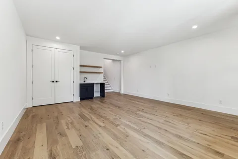 a front view of a residential apartment building with a yard