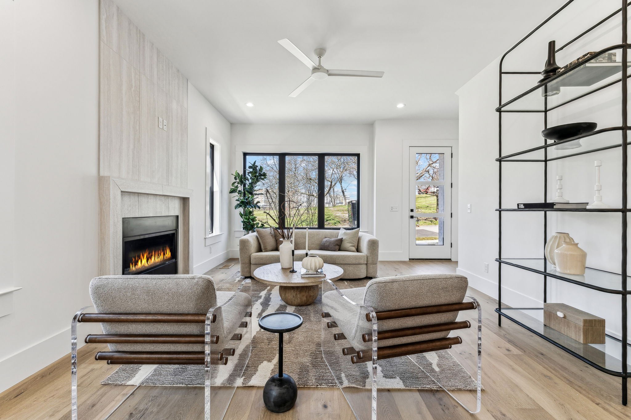 3135 Parthenon Avenue, Unit A Nashville, TN 37203 - Photo 6 of 77 a living room with furniture a ceiling fan and a fireplace