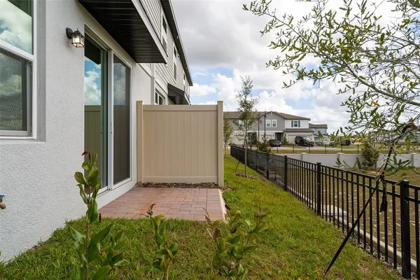 a view of a backyard with pathway