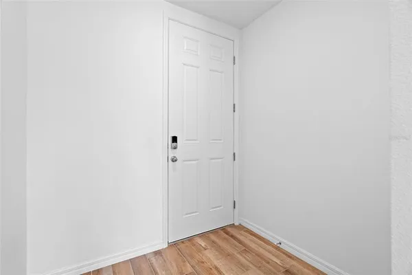 a view of a small space with wooden floor