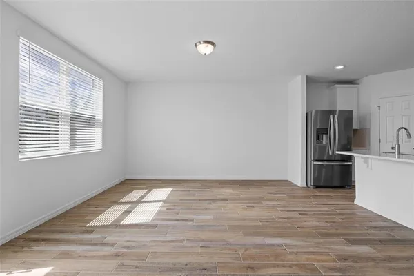 a view of a kitchen with a sink dishwasher and a window