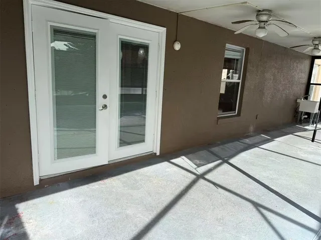 a bedroom with a bed and a large mirror