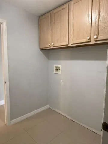 a view of cabinets and window