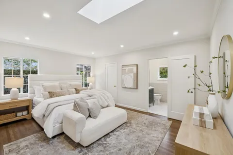 a bedroom with a bed and a couch