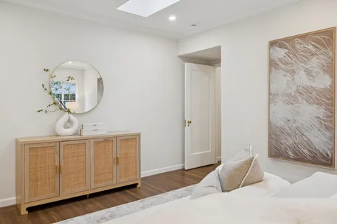 a bedroom with a bed and cabinets