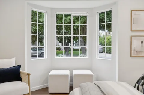 a living room with furniture and windows