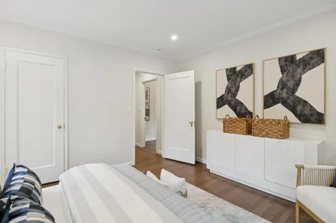 a bedroom with a bed and a couch
