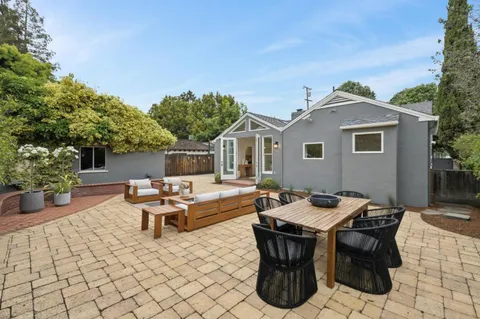a view of an outdoor sitting area with furniture