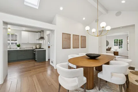 a kitchen with a table and chairs