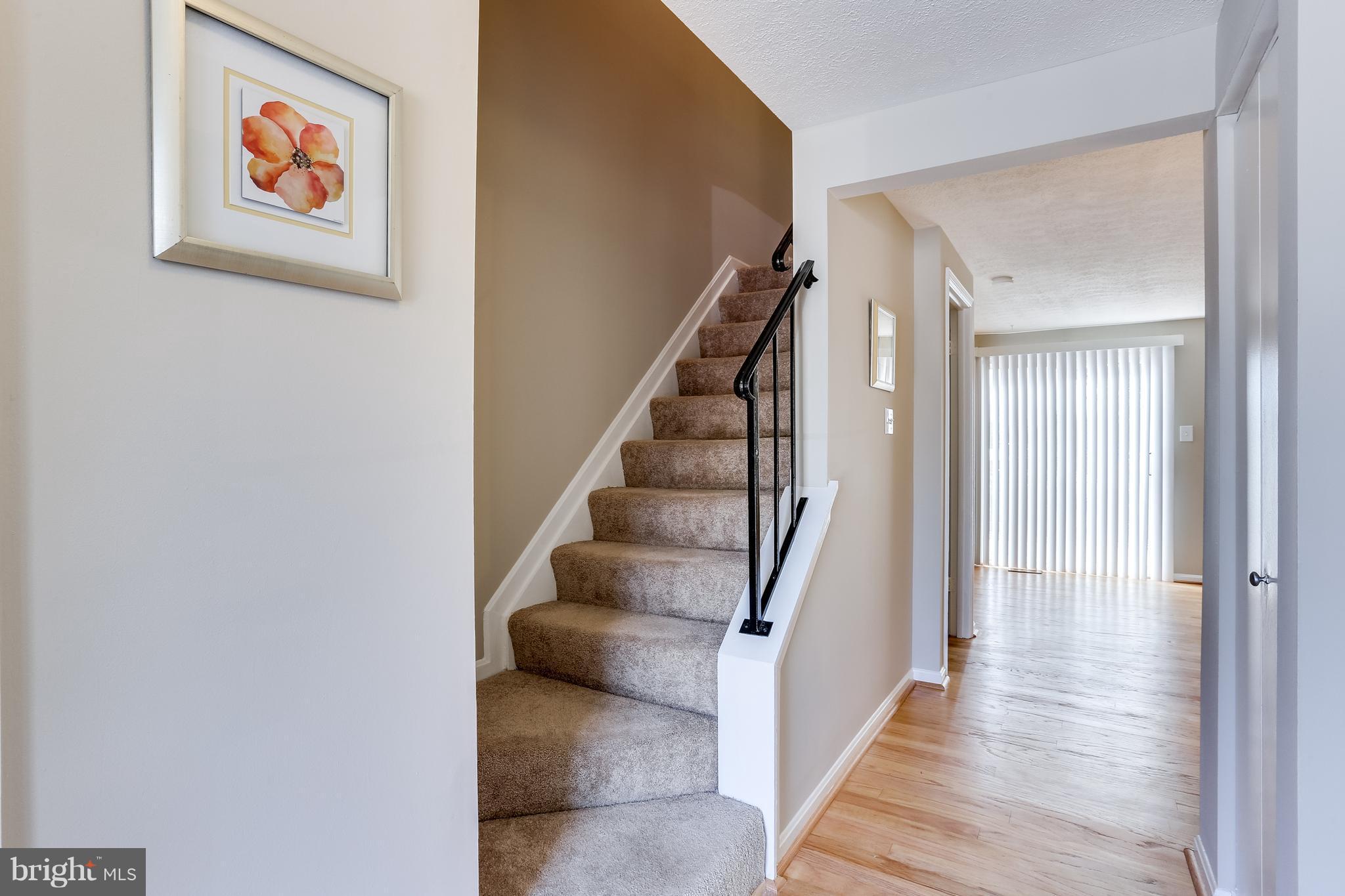 7204 Procopio Circle Columbia, MD 21046 - Photo 12 of 30 a view of a hallway with wooden floor and entryway