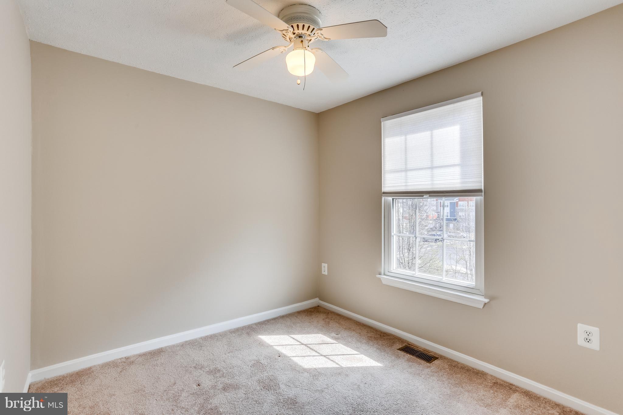 7204 Procopio Circle Columbia, MD 21046 - Photo 16 of 30 an empty room with windows and fan