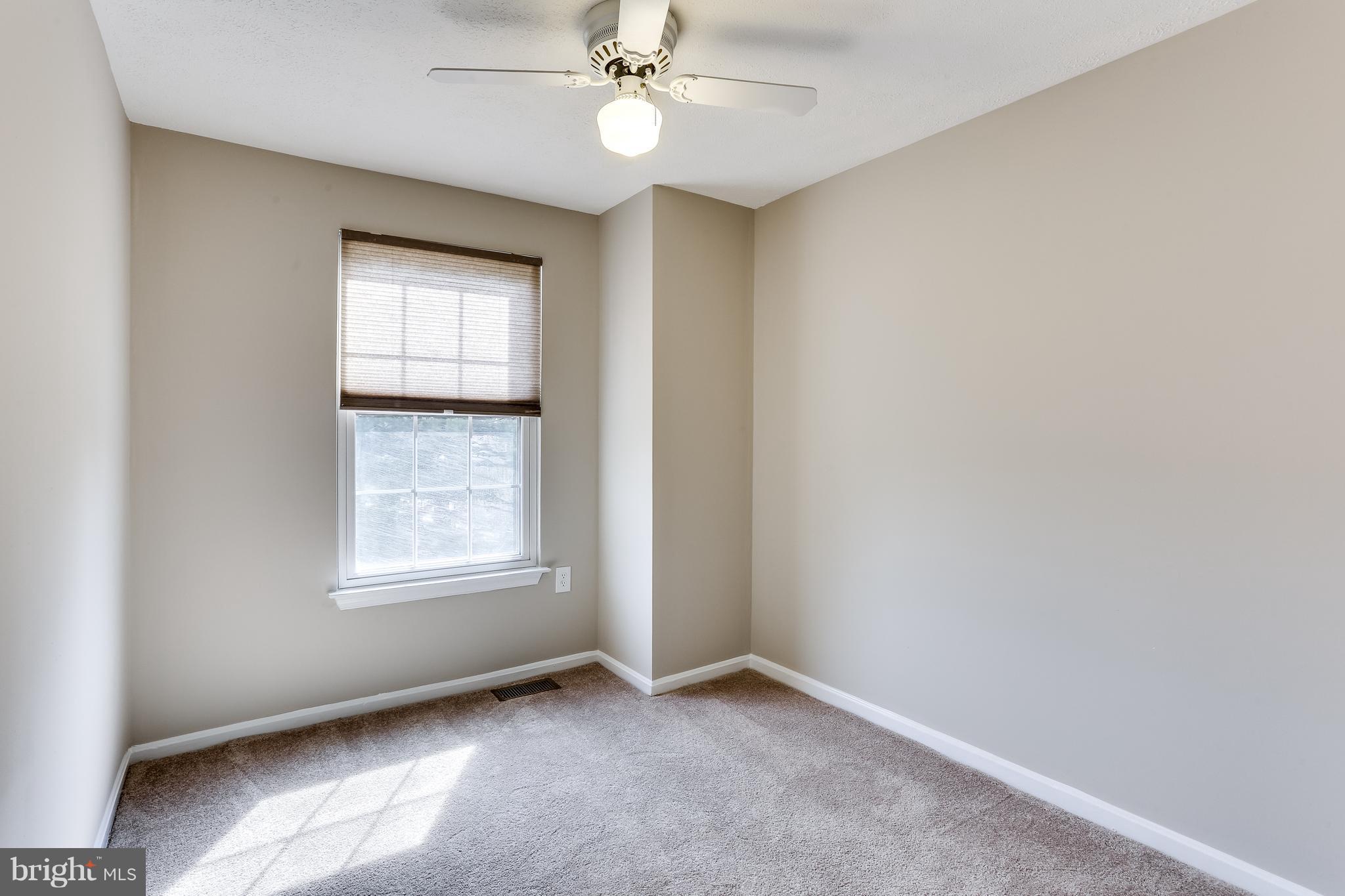 7204 Procopio Circle Columbia, MD 21046 - Photo 18 of 30 an empty room with windows and fan