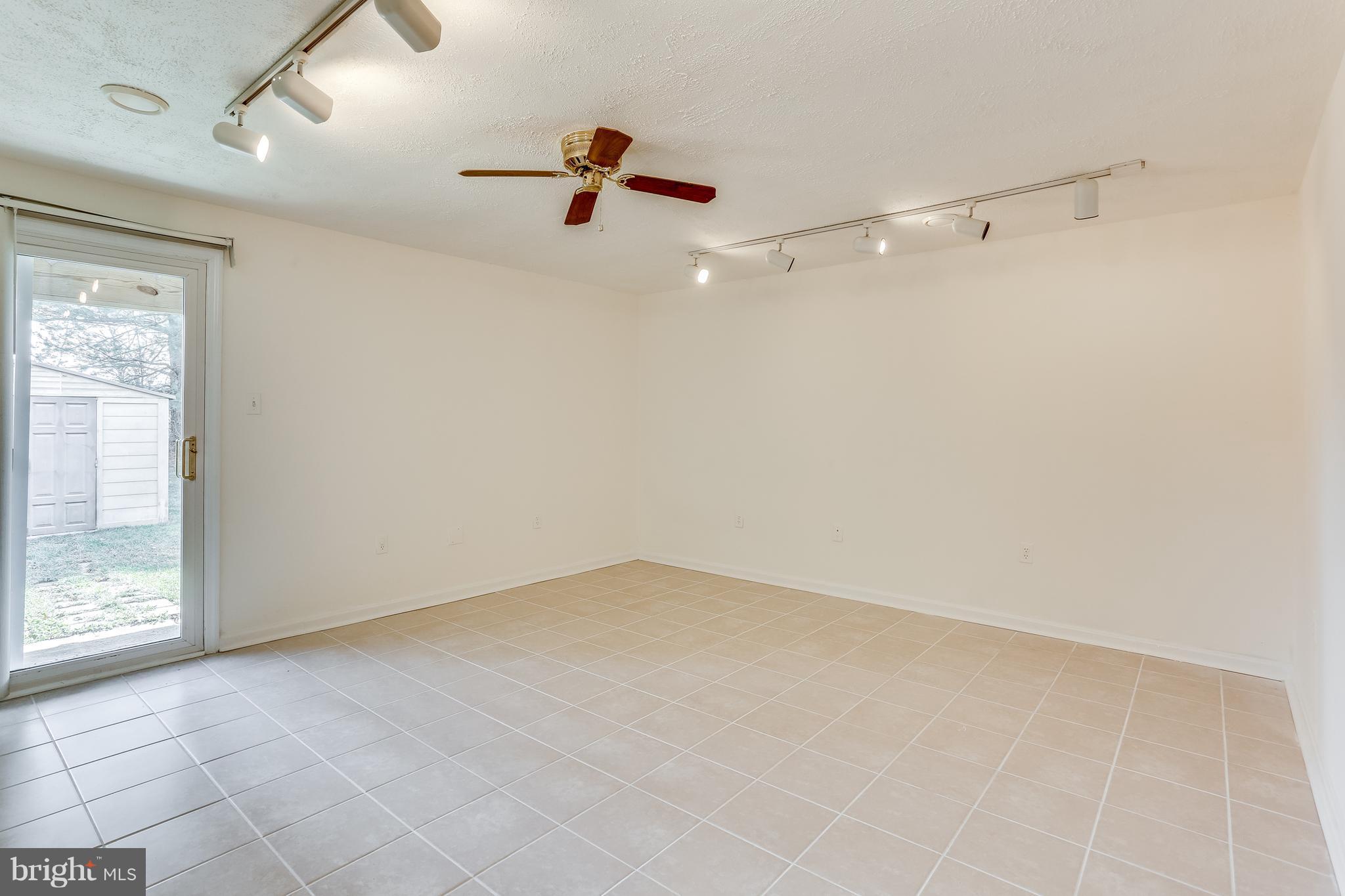 7204 Procopio Circle Columbia, MD 21046 - Photo 22 of 30 an empty room with a ceiling fan and window