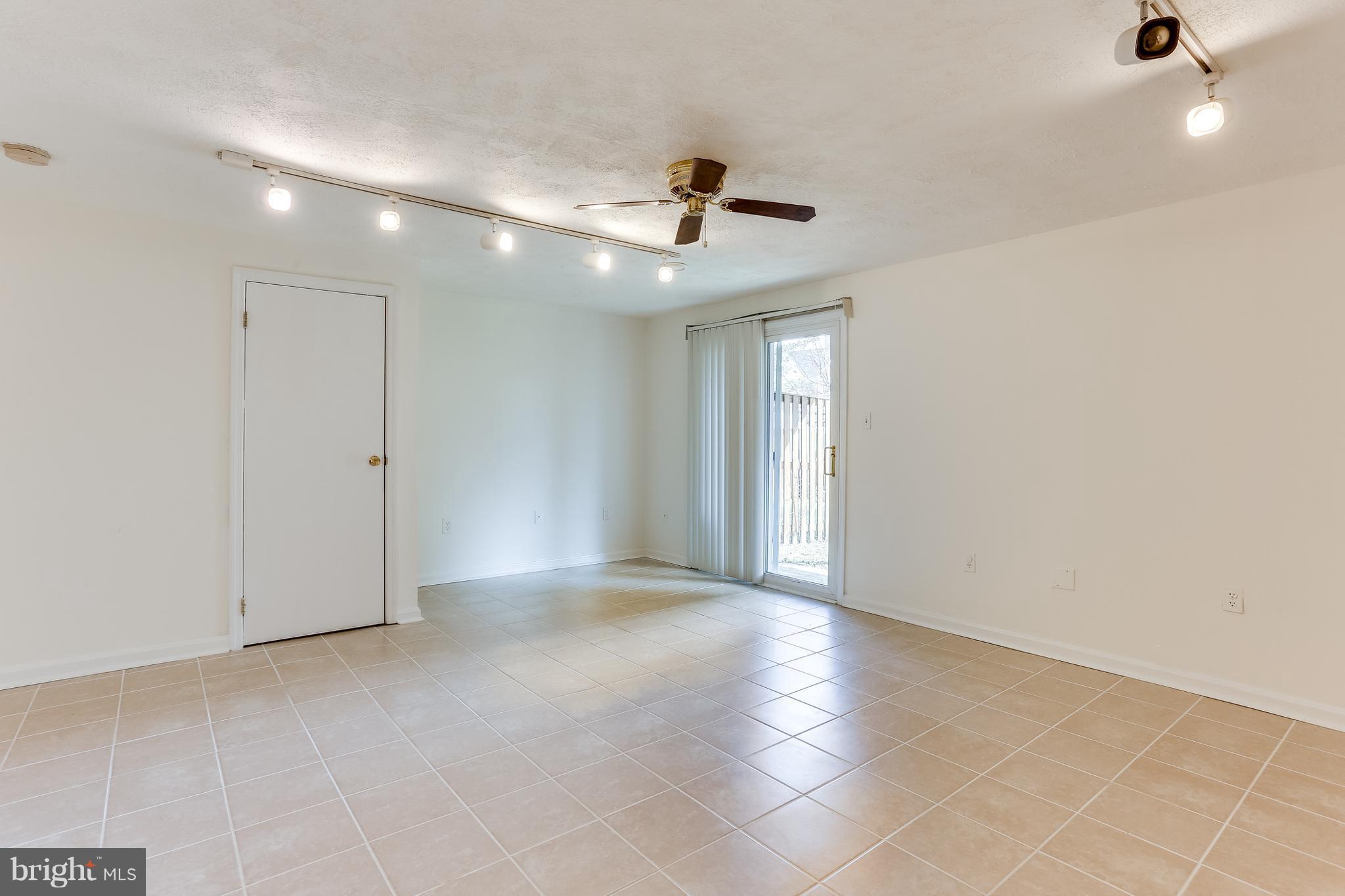 7204 Procopio Circle Columbia, MD 21046 - Photo 23 of 30 a view of an empty room with a ceiling fan