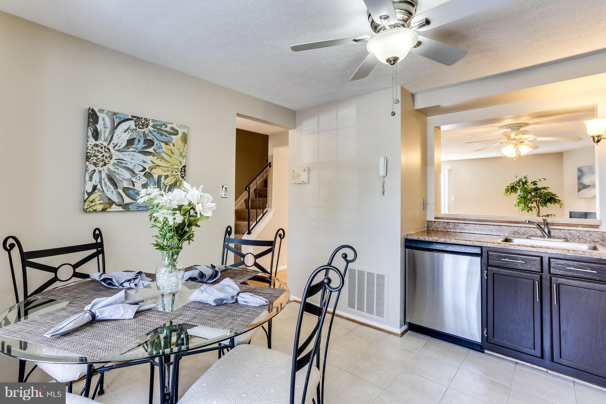 7204 Procopio Circle Columbia, MD 21046 - Photo 5 of 30 a view of a dining room with furniture and chandelier