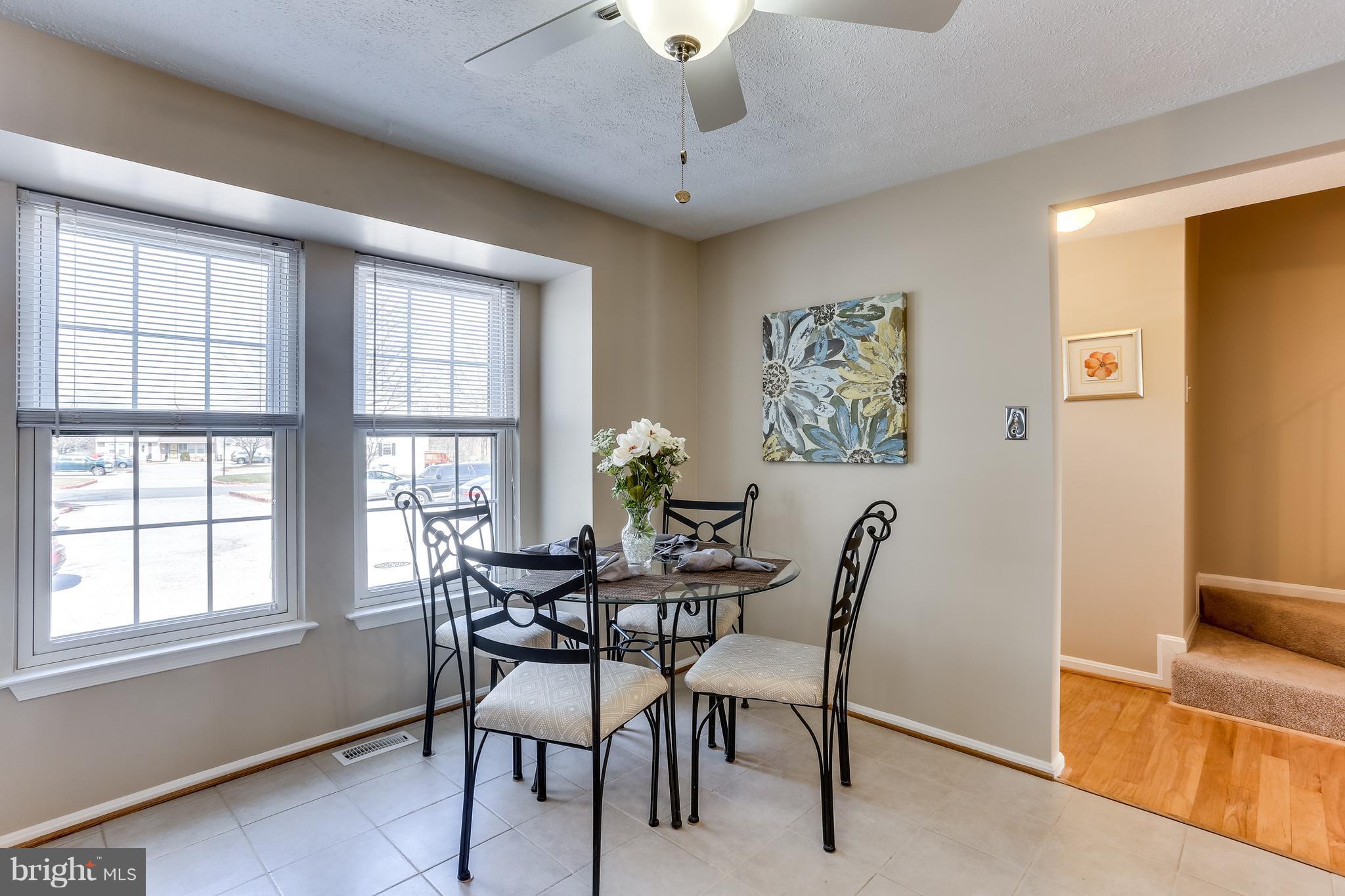 7204 Procopio Circle Columbia, MD 21046 - Photo 6 of 30 a view of a dining room with furniture and windows
