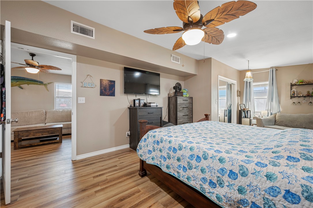 622 South Sandpiper Ingleside, TX 78362 - Photo 14 of 38 a bedroom with a bed and a flat screen tv