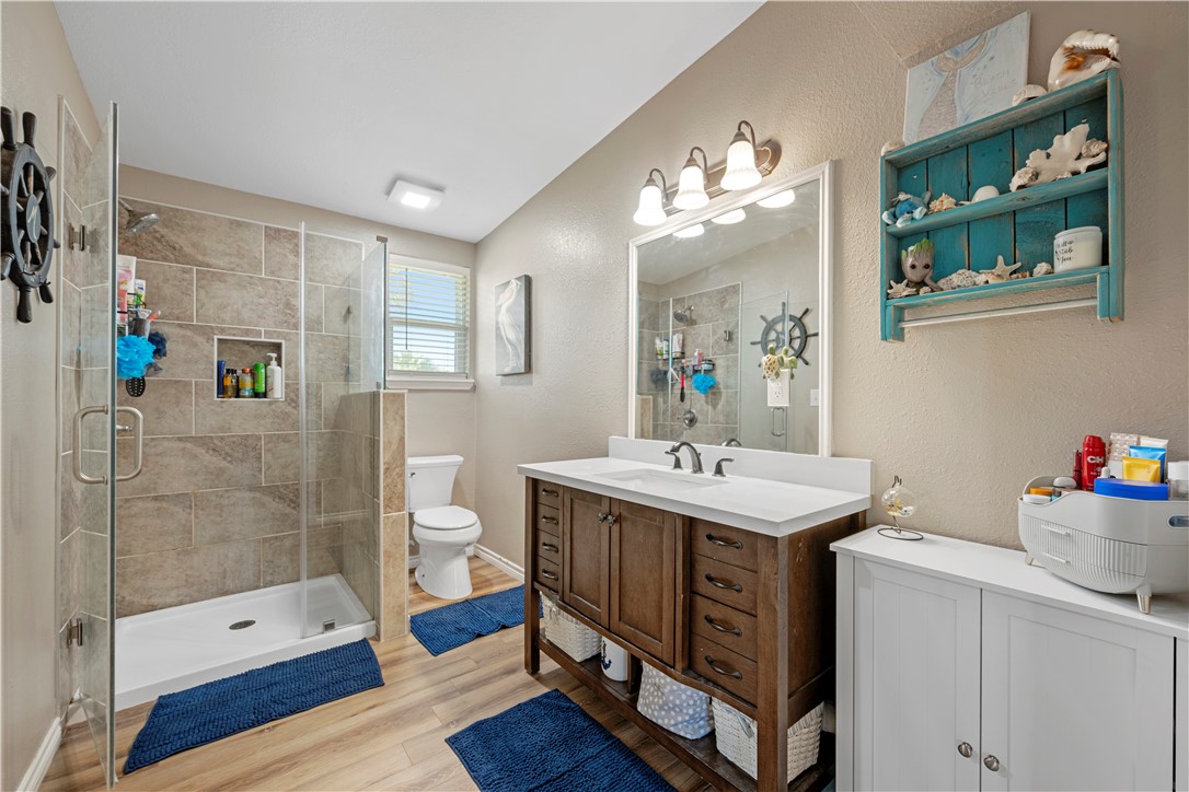 622 South Sandpiper Ingleside, TX 78362 - Photo 16 of 38 a bathroom with a sink a toilet and shower