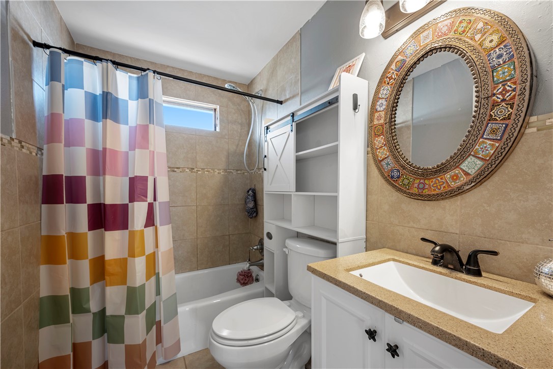 622 South Sandpiper Ingleside, TX 78362 - Photo 30 of 38 a bathroom with a sink toilet and shower