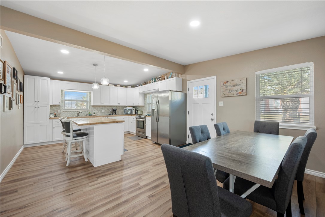 622 South Sandpiper Ingleside, TX 78362 - Photo 6 of 38 a view of a dining room with furniture and wooden floor