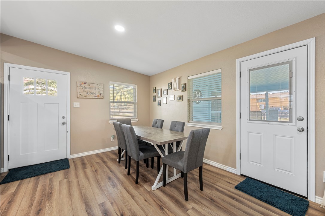 622 South Sandpiper Ingleside, TX 78362 - Photo 9 of 38 a view of a dining room with furniture window and wooden floor