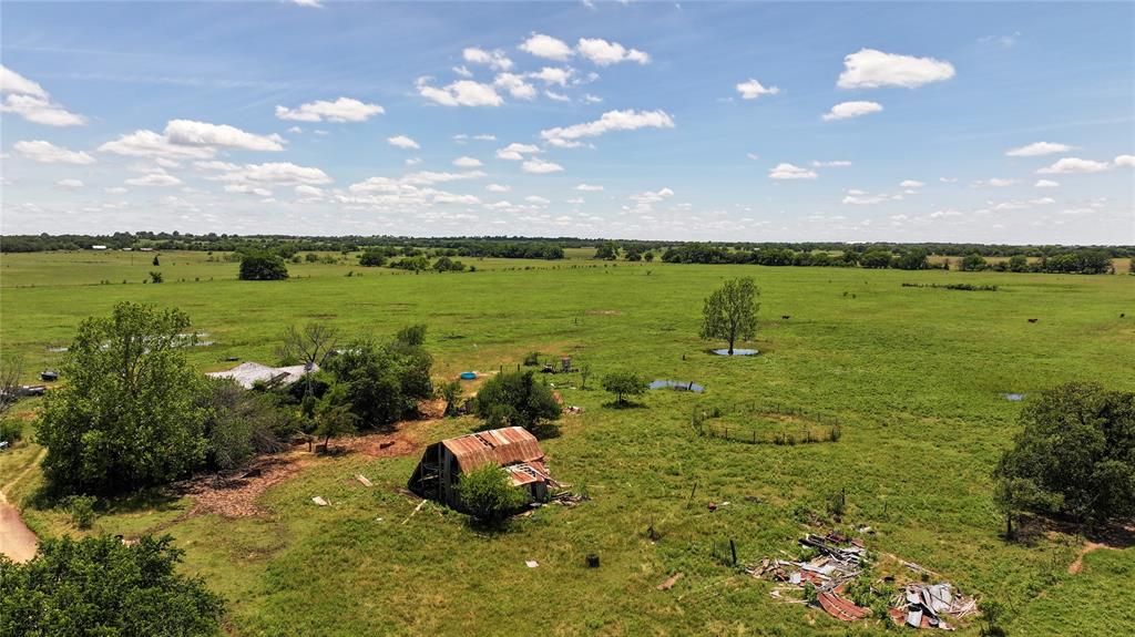 1409 Flagley Road Nocona, TX 76255 - Photo 11 of 21 a view of a lake from a yard