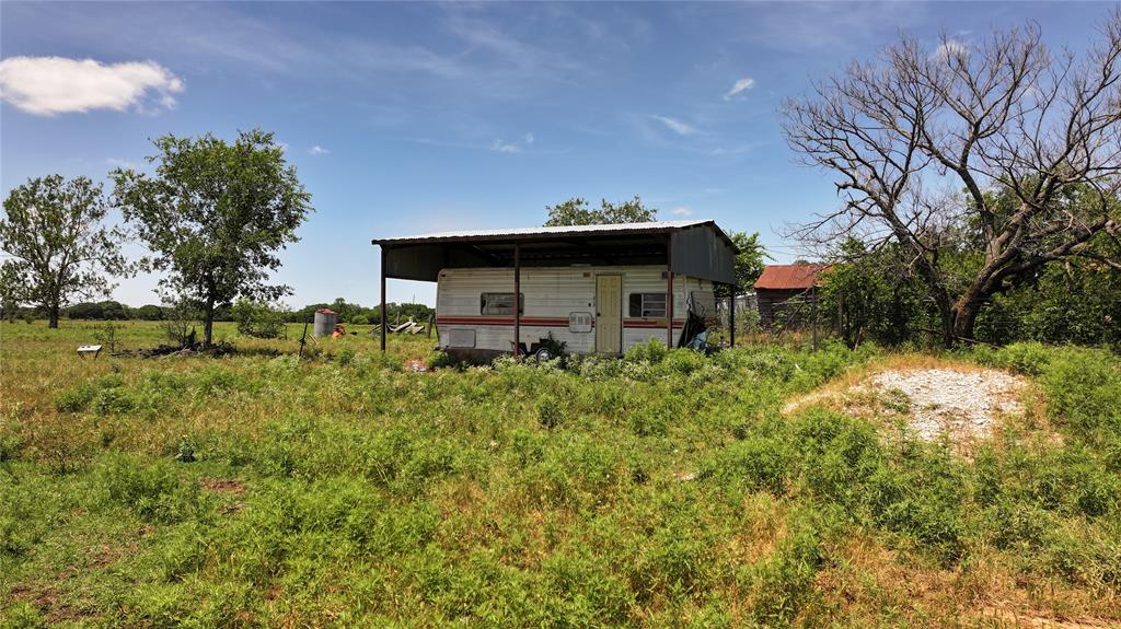 1409 Flagley Road Nocona, TX 76255 - Photo 12 of 21 a backyard of a house with lots of green space