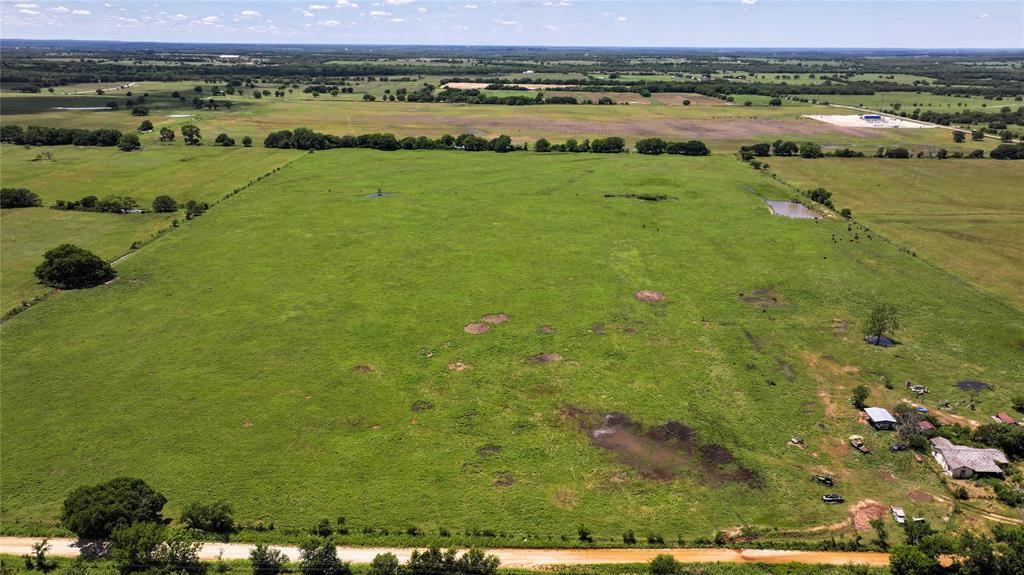 1409 Flagley Road Nocona, TX 76255 - Photo 17 of 21 a view of a lake with a field