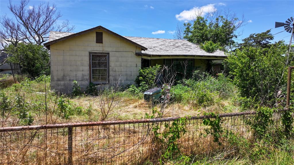 1409 Flagley Road Nocona, TX 76255 - Photo 19 of 21 a front view of a house with a yard