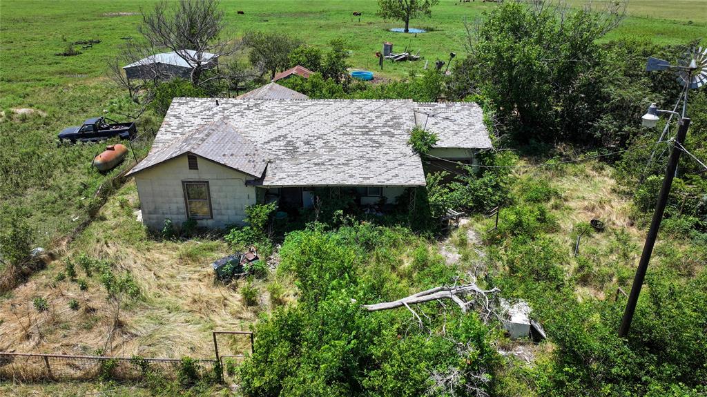 1409 Flagley Road Nocona, TX 76255 - Photo 20 of 21 a view of a garden with a fountain