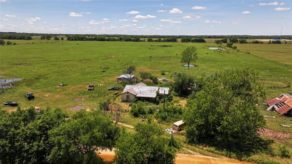 1409 Flagley Road Nocona, TX 76255 - Photo 10 of 21 a view of a lake with a building in the background