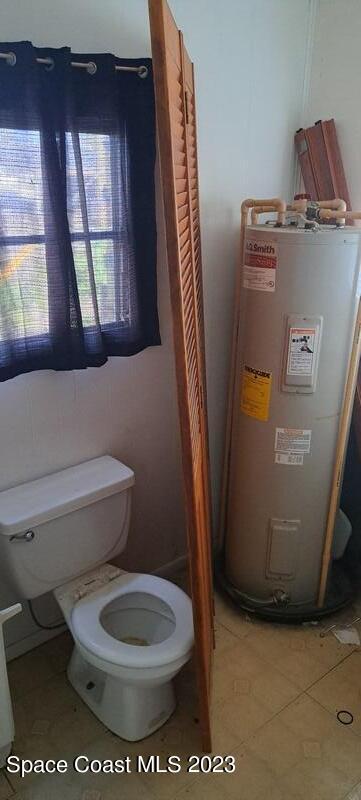 3133 Kinsley Road Mims, FL 32754 - Photo 5 of 8 a white toilet sitting next to a window