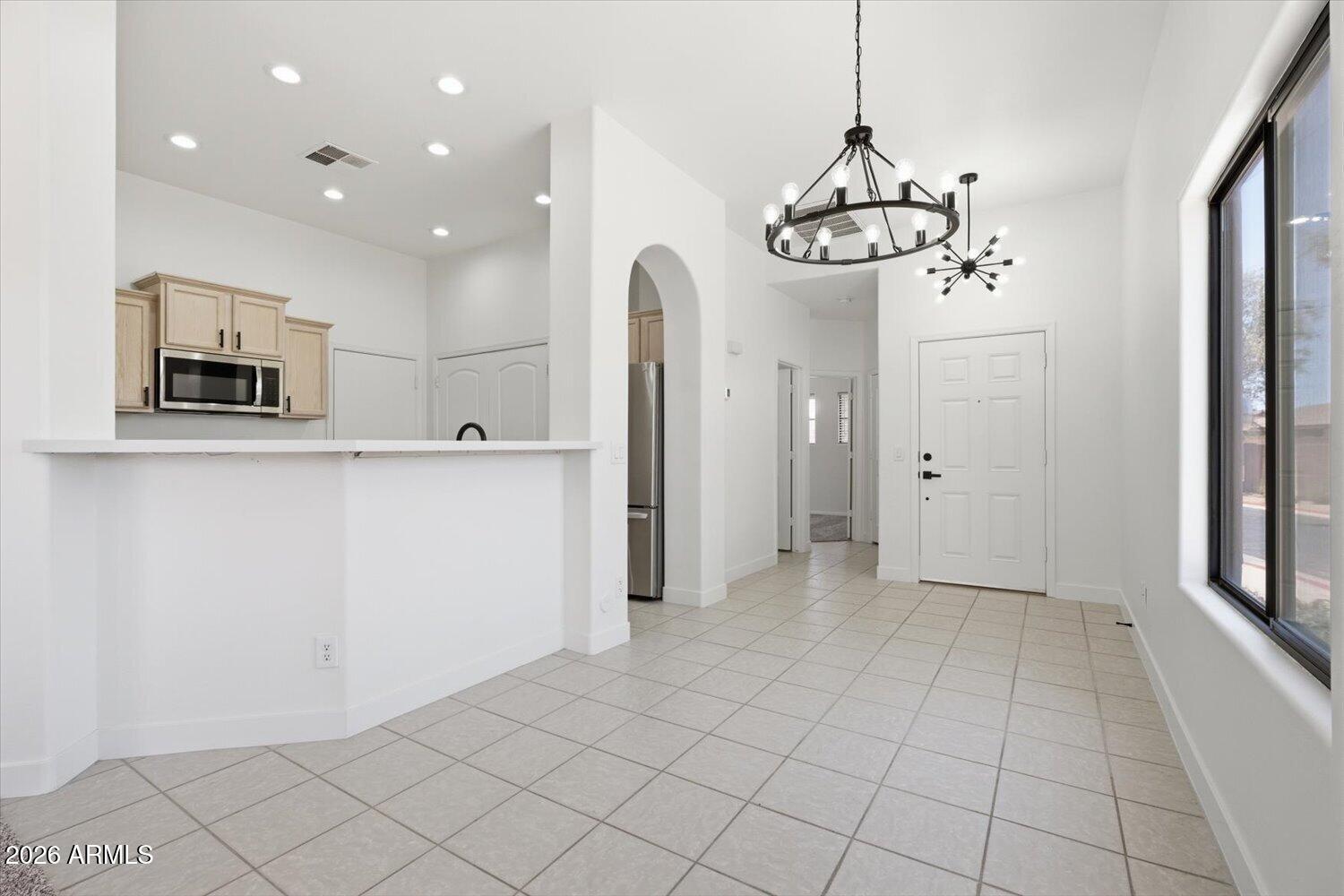 2565 South Signal Butte Road, Unit 23 Mesa, AZ 85209 - Photo 4 of 29 a view of a kitchen with a sink and refrigerator