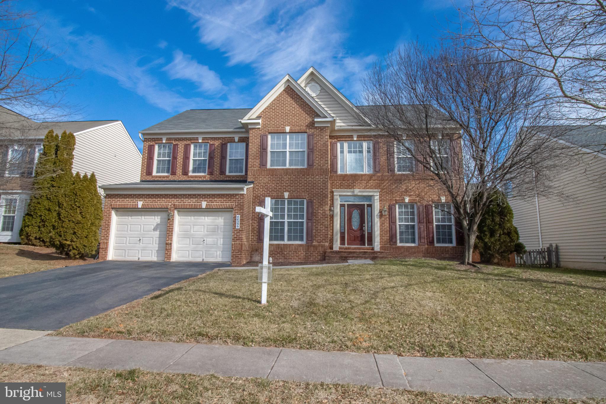 44399 Apache Circle Ashburn, VA 20147 - Photo 1 of 48 a front view of a house with a yard