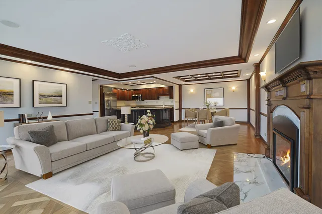 a view of a room with stainless steel appliances wooden floor and floors