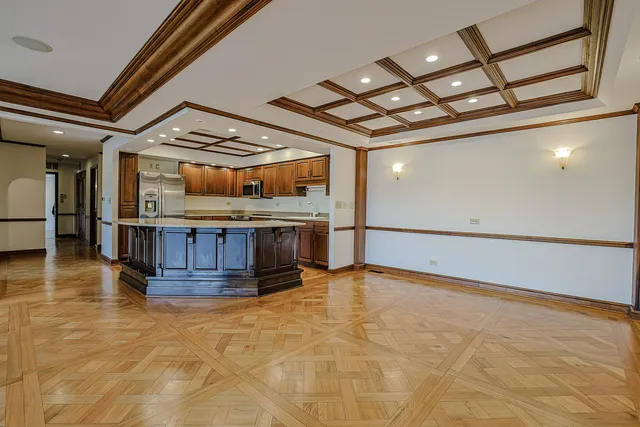 a kitchen with stainless steel appliances granite countertop a stove a sink dishwasher and a refrigerator