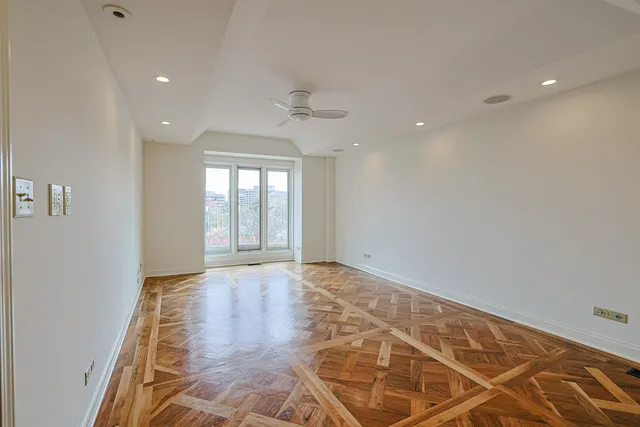 a spacious bedroom with a bed and a couch