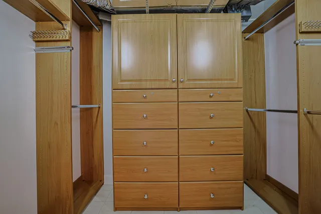 a white toilet sitting next to a shower
