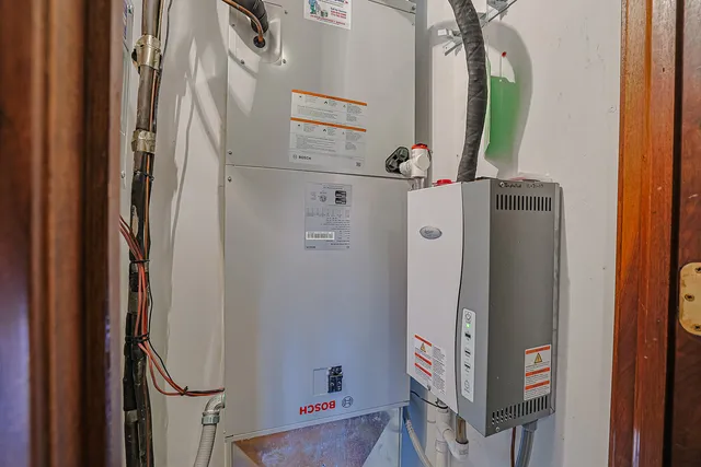 a bathroom with a granite countertop sink mirror vanity and toilet