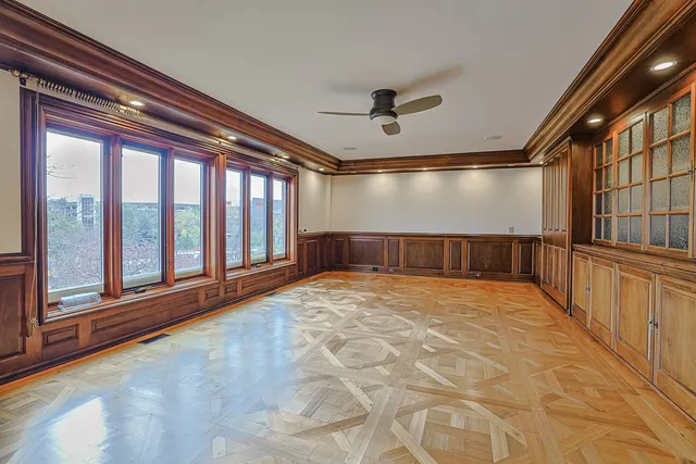 a bedroom with a large bed and a large window