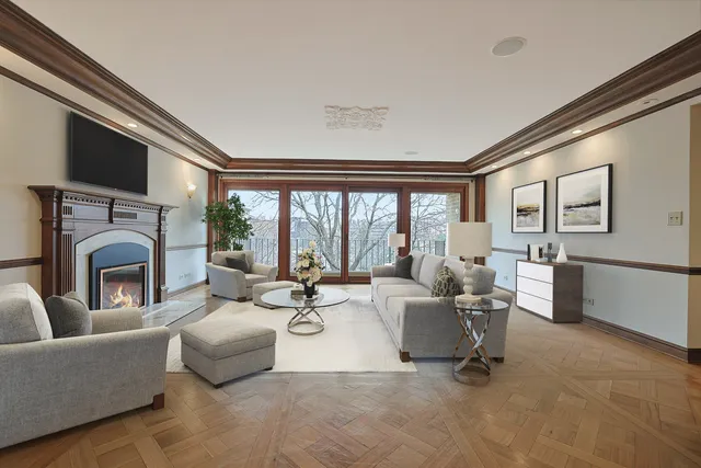 a view of an empty room with fireplace and a window