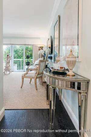 a view of furniture and floor to ceiling window