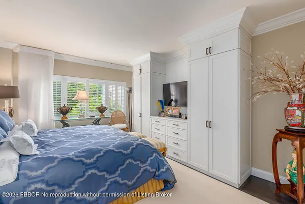 a bed room with a bed and a television