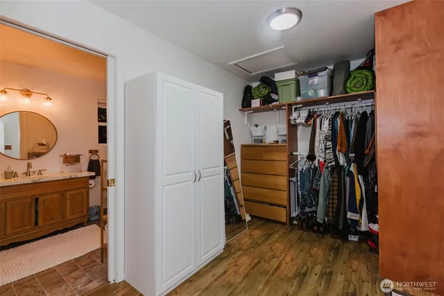 a bathroom with a sink a mirror a toilet and a mirror