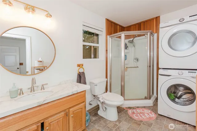a bathroom with a toilet a sink and mirror