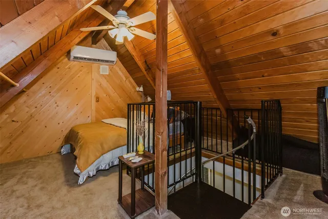 a view of house with backyard and trees in the background