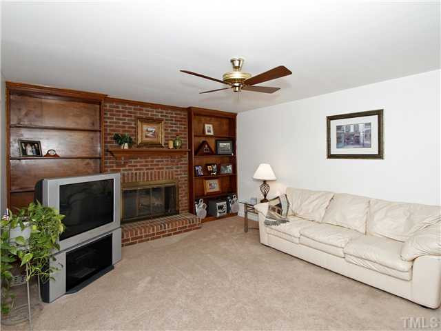 4301 Hickory Ridge Drive Raleigh, NC 27609 - Photo 9 of 25 Built in bookcases flank the all brick, full masonry fireplace. Den/Family/Great Room